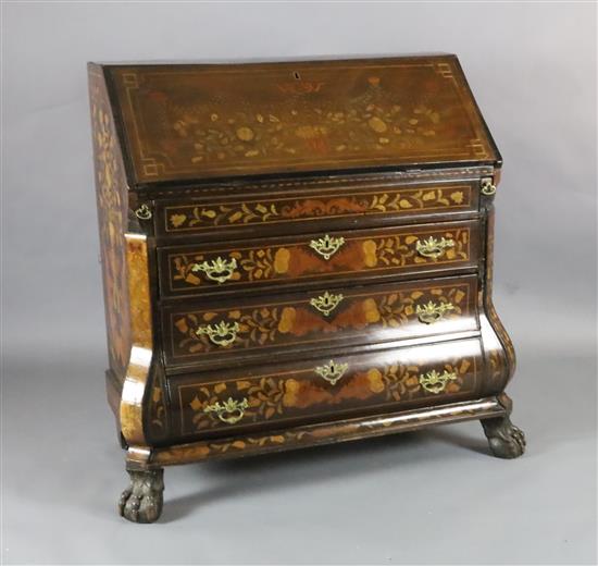 An early 19th century Dutch marquetry inlaid walnut bombe base bureau, W.3ft 10in. D.2ft H.3ft 8in.